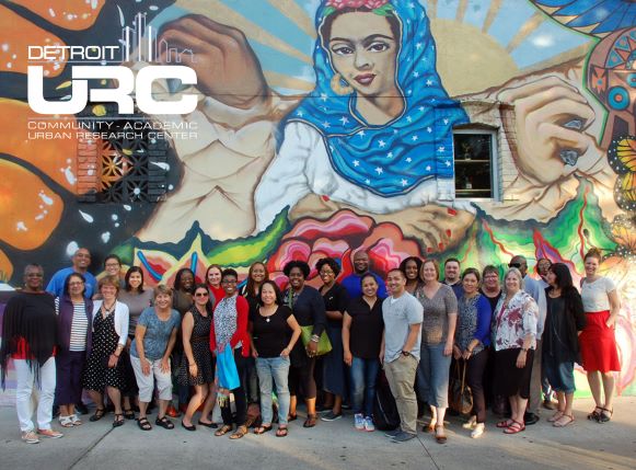 Image of participants in Detroit with the Detroit URC logo superimposed.
